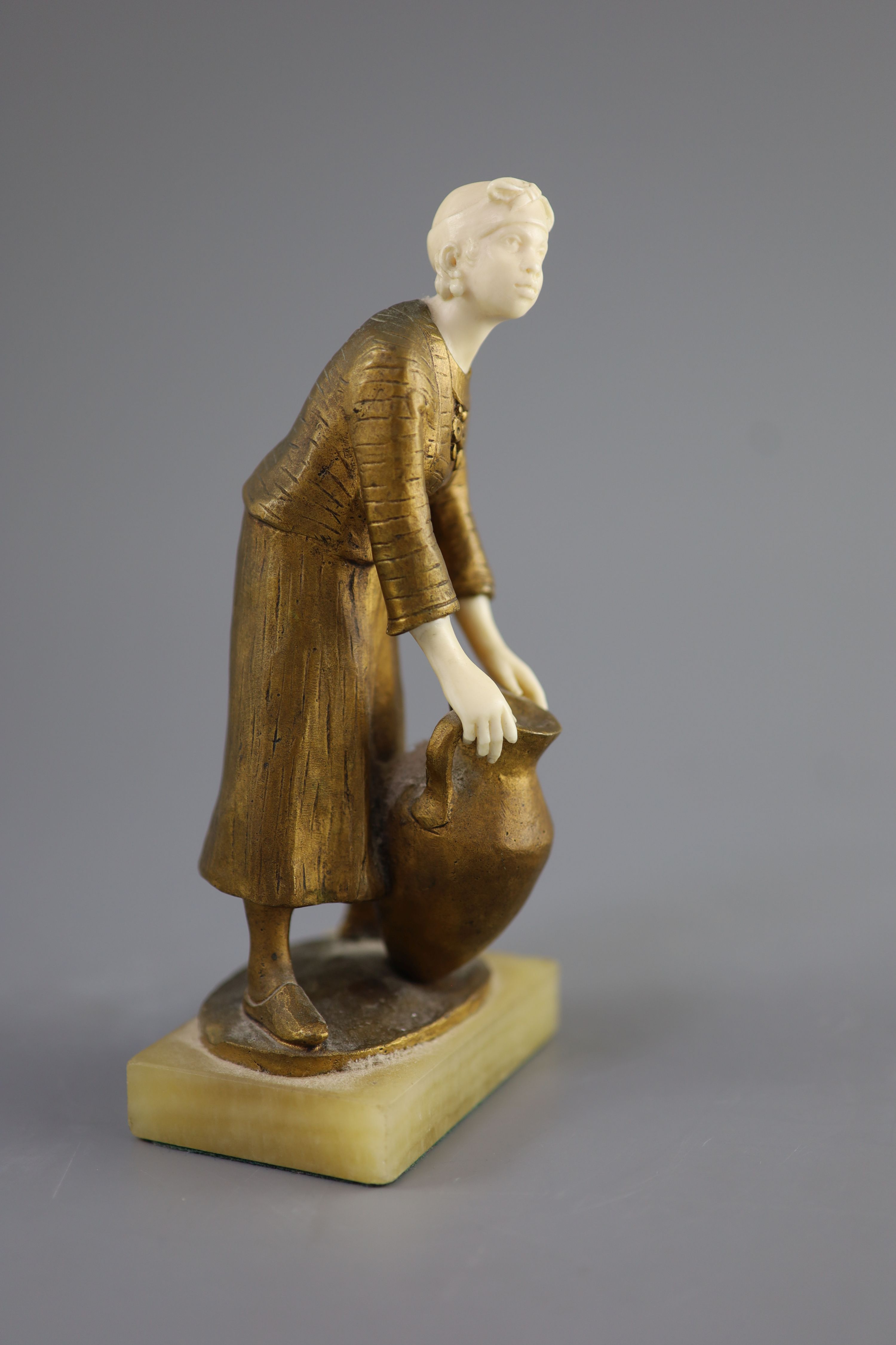 Hélène Maynard White (American, b.1870). A bronze and ivory study of an African girl with amphora base, c1920, 19cm high